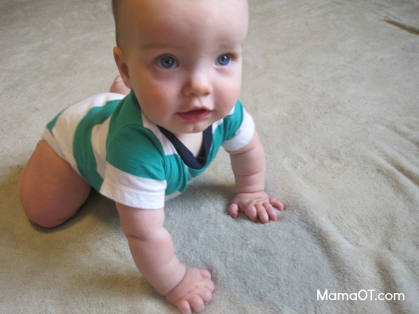 Between approximately 8-9 months, babies develop the ability to assume a quadruped position on hands and knees in preparation for the exciting milestone of crawling! #childdevelopment #mamaot #pediOT 