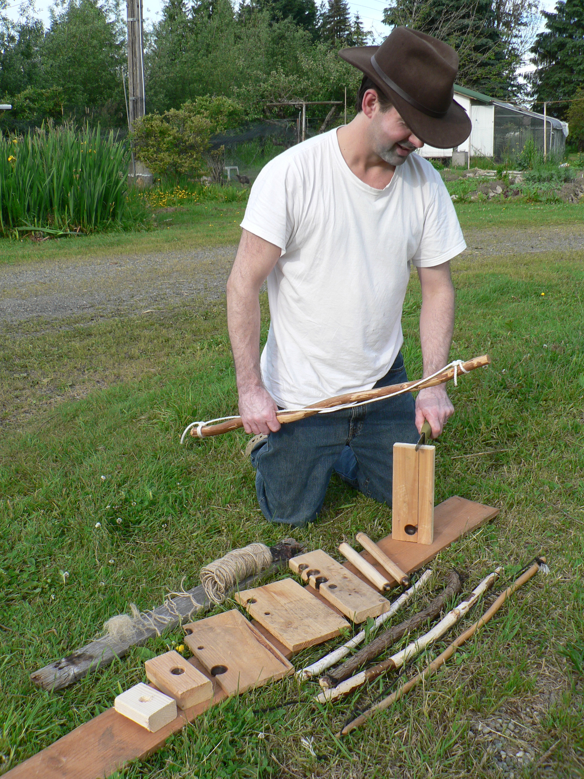 Chris Chisholm with a display of Bow Drill Kit Pieces