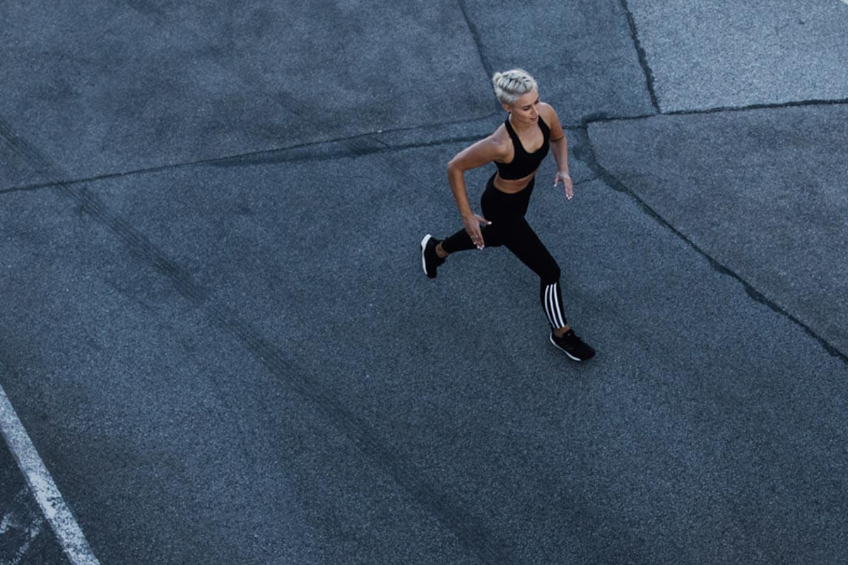 A young female runner in an urban area