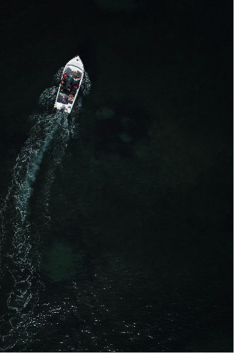 An aerial photo of a boat at sea - golden ratio vs rule of thirds