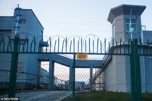 A perimeter fence is seen around what is officially known as a vocational skills education centre in Dabancheng in Xinjiang where a million ethnic Uighurs are believed to be held. Officials have been forcing visitors to unlock and turn over their devices when they travel from neighbouring Kyrgyzstan to Xinjiang