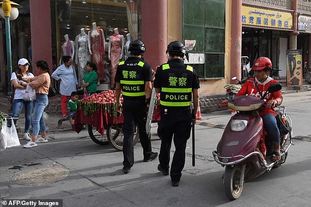 Police officers patrolling in Kashgar, Xinjiang on June 4. UN experts and activists say at least one million ethnic Uighurs and other Muslims are held in the detention centres in the region