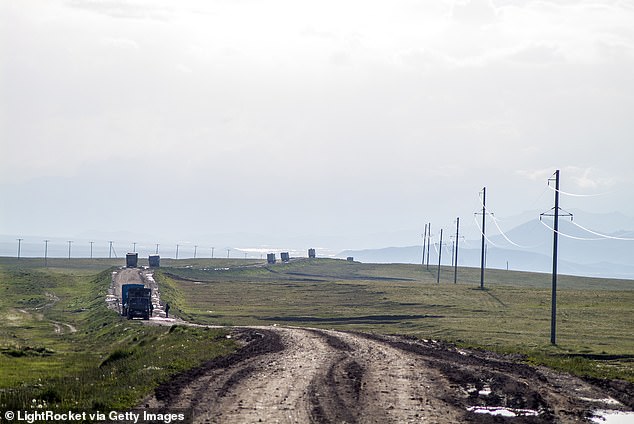 Trucks on the road to the Chinese border at Irkeshtam in the Alay Valley in Kyrgyzstan. The Irkeshtam border is China