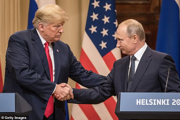 Arms race? Donald Trump and Vladimir Putin shake hands in Helsinki in July - but there are growing fears of a new arms race between their two countries