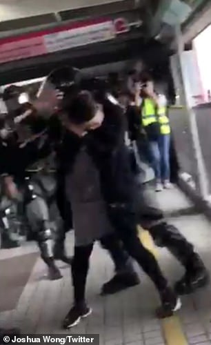 The same officer then drags the woman by the back and pushes her towards his colleagues