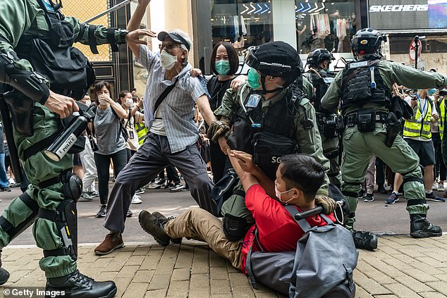 Pictures: Pro-democracy supporters in Hong Kong clash with riot police on May 27, as they demonstrate during the second day of debate on a contentious bill that would criminalize insulting or abusing the Chinese national in the city
