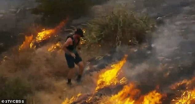 An Arizona jogger tried to put out a wildfire near Phoenix on Friday using just his shoes