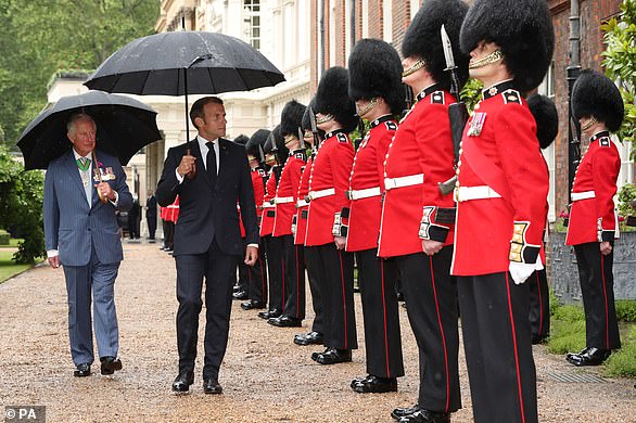 Prince Charles and French president Emmanuel Macron inspecting the Grenadier Guards at Clarence House in London, June 18, 2020