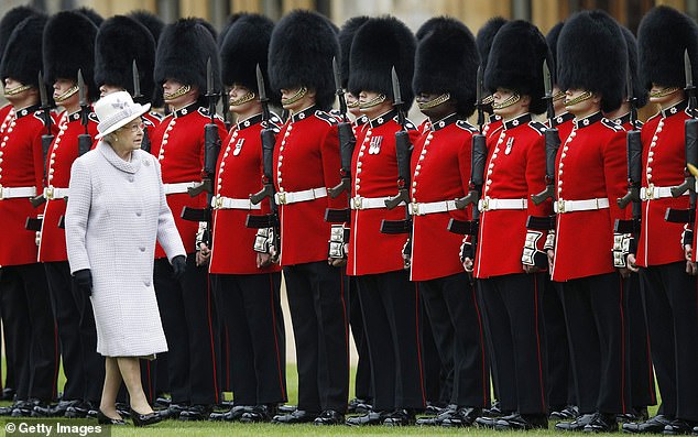 Seven Army regiments, including the Coldstream Guards and Welsh Guards, are authorised to wear the 18-inch black headwear following the defeat of French Emperor Napoleon in 1815 (pictured: The Queen inspects the guards in 2012)