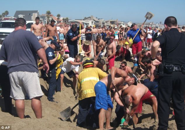 A large crowd gathered as people dug desperately around the teenager