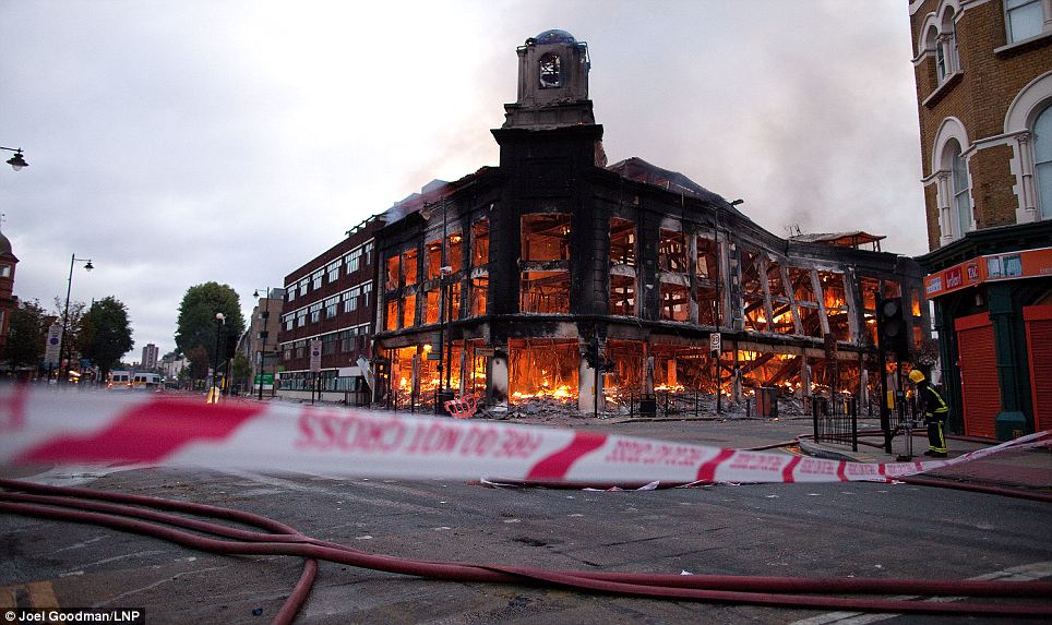 Aftermath: A building that was set ablaze in Tottenham is just an empty shell this morning