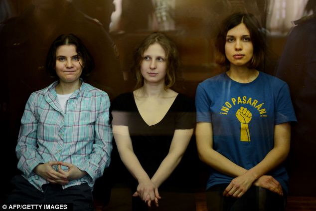 Three Pussy Riot members, Ms Tolokonnikova (right), Maria Alyokhina (centre) and Yekaterina Samutsevich (left) were jailed after staging a protest in Moscow