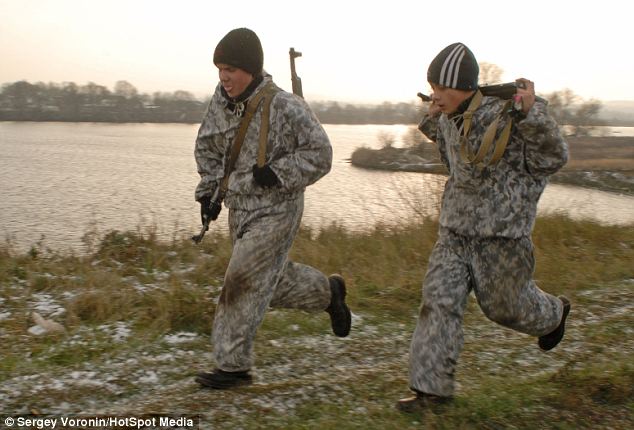 Fitness test: Every year camouflage clad children and adults from the club march into the mountains of the Crimea for an annual 130km trek