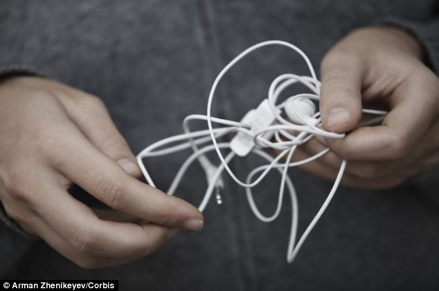Not music to your ears: Physicists have unravelled why wires get tangled up within seconds. When shaken up in a confined space, the wires from coils and the loose end weaves though the other strands, creating an annoying knot (pictured)