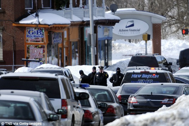 Attempted heist: Police swarm around the Achieve Financial Credit Union in New Britain, Connecticut on February 23, 2015, after Yussman was found in the parking lot with a device strapped to his chest