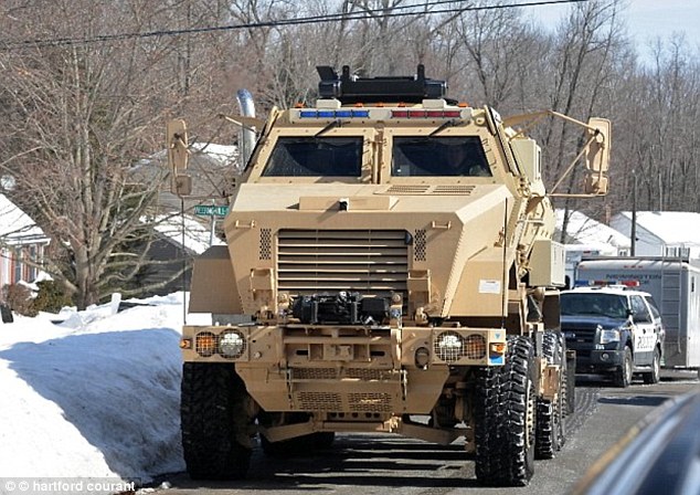 Scare: Armored vehicles were seen on the scene before investigators learned the device would not go off. Yussman said two men stormed into his home that morning and took and his mother hostage