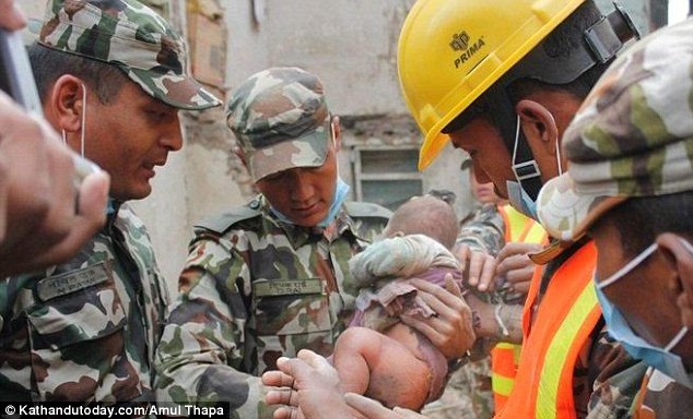 Team work: The military team then found the young boy when they returned to the area for the second time