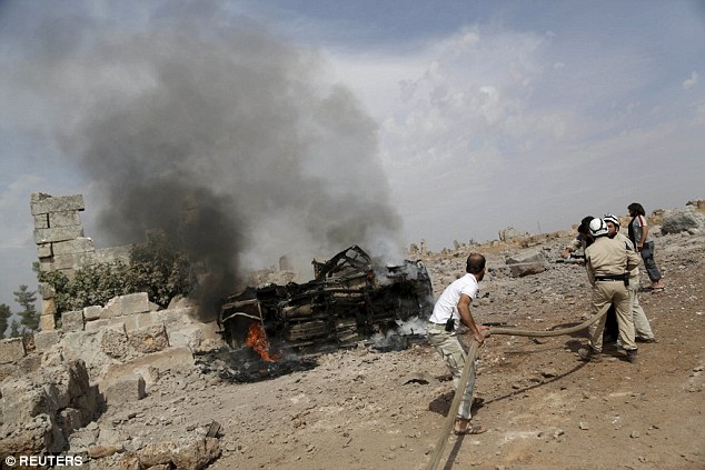 Under attack: A base controlled by rebel fighters from the Ahrar al-Sham Movement (pictured)  was targeted by what activists said were Russian airstrikes in Syria