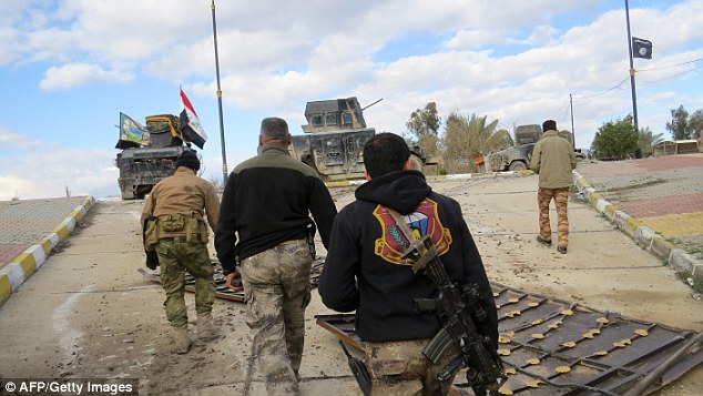 Iraqi forces patrol neighbourhoods in the city of Ramadi as they try to secure the area from ISIS fighters