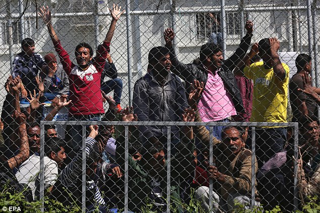 Migrants from Afghanistan and Pakistan protest against deportations in the hotspot refugee camp, formerly a detention centre, in Moria, Lesbos