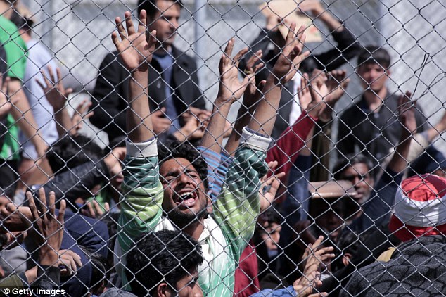 MYTILENE, GREECE -  APRIL 05:  Refugees from Afghanistan and Pakistan protest at the detention center against their deportation to Turkey on April 5, 2016 in Lesbos, Greece. Scores migrants are being returned to Turkey following an EU agreement with the Turkish authorities to tackle Europe