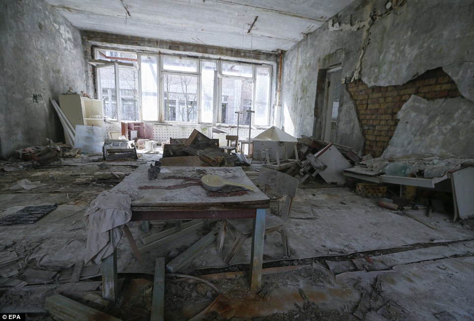 Rotten: An abandoned room in a former kindergarten in the empty town of Pripyat. Dust coats the floors and tables and the walls are falling down