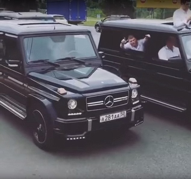 Brazen: The brash automobile parade took place through the streets of Moscow with horns blaring