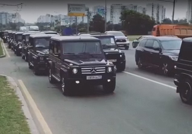 Show of strength: Newly graduated FSB agents form a cortege of black Mercedes Gelandewagens in Russia