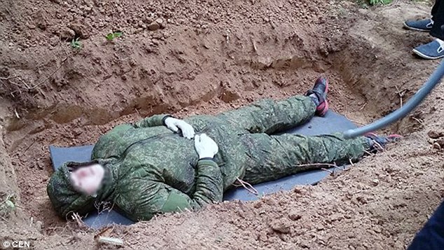 Six feet under: Russians have reportedly been queuing up to be buried alive in Moscow