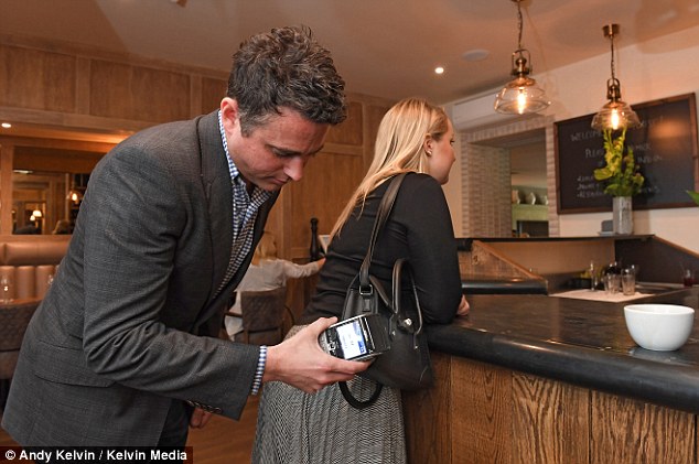 Sly swipe: Morgan Rothwell shows how easily he can steal Victoria’s money with a card reader