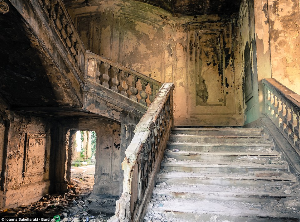 This  former government building in Sukhumi, Abkhazia, has been neglected. The staircase and floor can be seen littered with rubble and dust