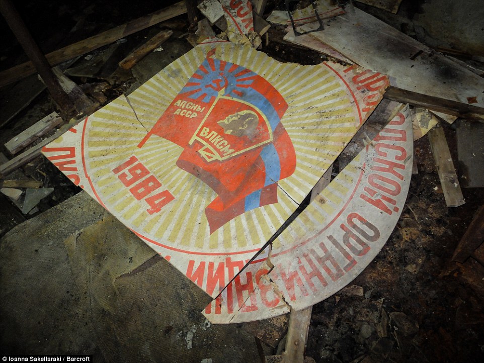Soviet-era iconography could be seen on smashed signs and placards in one abandoned government building