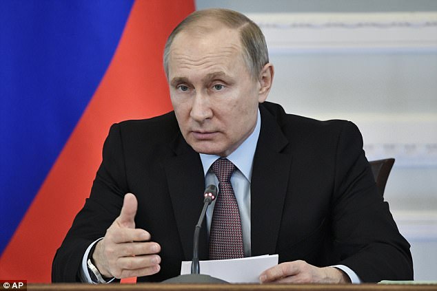 Putin (pictured) has reportedly been warned that in the event of a US strike on Kim Jong-un