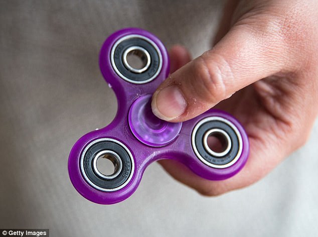 The pocket-size gadgets (pictured) are popular with children after the new craze swept the nation 