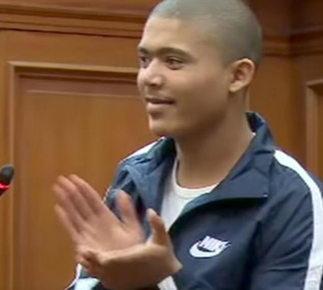 Cameron Wilson claps at the&nbsp;Western Cape High Court Judge Chantel Fortuin after she sentenced him to 71 years