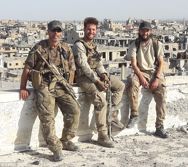Duttenhofer, pictured center with his friend Jac Holmes (right) and another comrade, worked alongside a sniper unit of Kurdish soldiers as they occupied empty buildings and shot at ISIS fighters in a bid to advance.