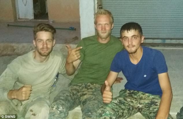 Duttenhoffer, pictured left with comrades also from outside Syria, said he was 