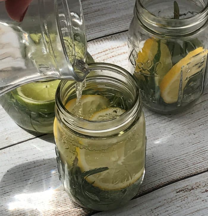 diy lemon, lime, rosemary citronella essential oil floating candles in mason jars for keeping away mosquitoes, flies, gnats, no see ums, and other bugs in summer