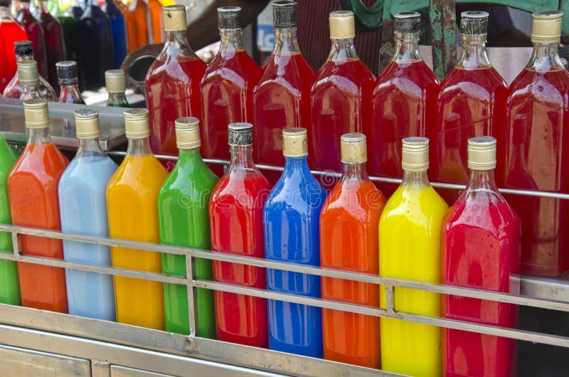 Colorful homemade fruit juice drink in asia market, India stock images