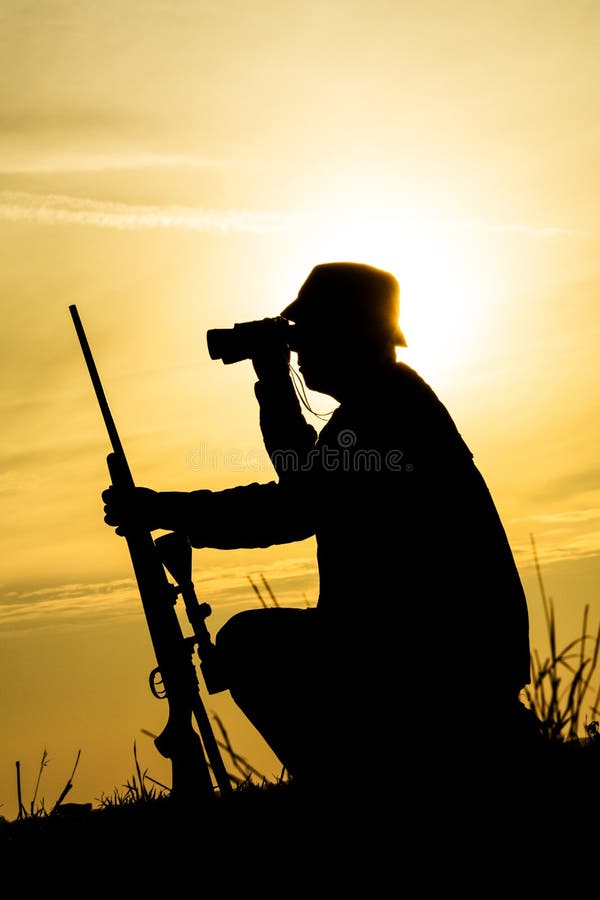 Hunter With Shotgun in Sunset royalty free stock image