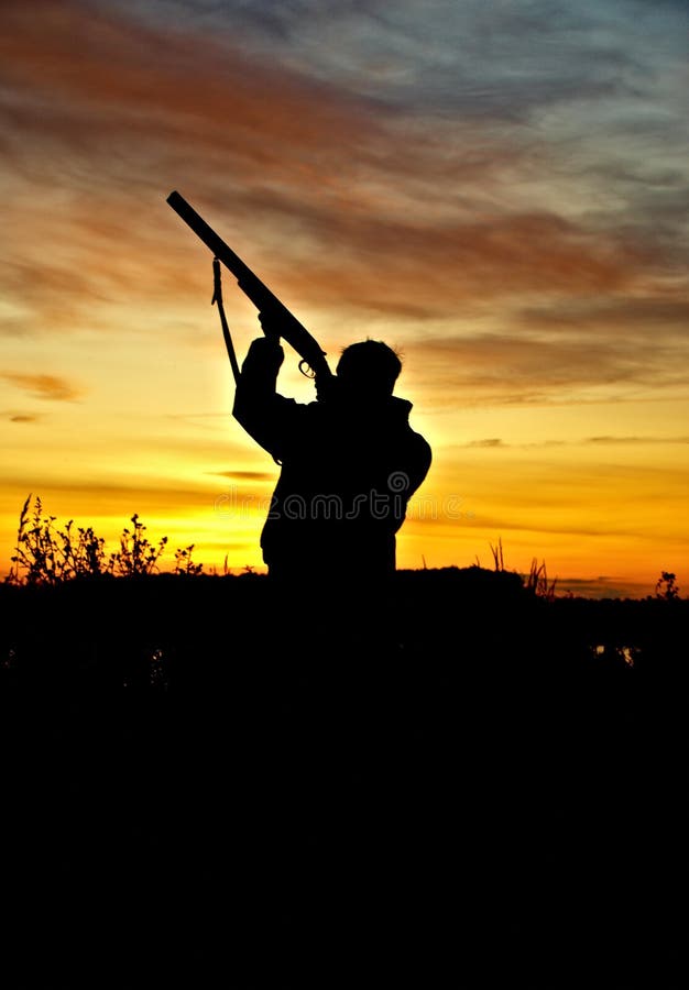 Hunter on sunset stock photos