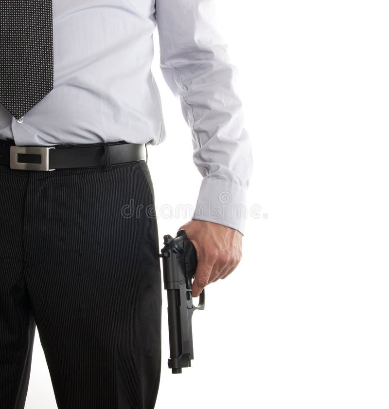 Man in suit with gun in his hand stock image
