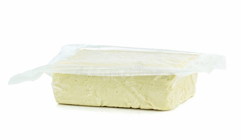 A vacuum packed block of tofu stock image