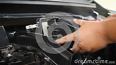 Hands of man using blue micro fiber fabric to clean the car engine stock video