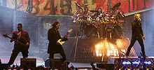 Chris Fehn, Corey Taylor und Shawn Crahan (v. l. n. r.) von Slipknot live auf dem Roskilde-Festival 2013