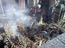 A montage of eight images depicting, from top to bottom, the World Trade Center towers burning, the collapsed section of the Pentagon, the impact explosion in the South Tower, a rescue worker standing in front of rubble of the collapsed towers, an excavator unearthing a smashed jet engine, three frames of video depicting American Airlines Flight 77 hitting the Pentagon