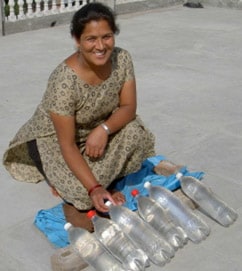A woman using SODIS, Swiss Federal Institute