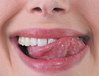Tongue test to check for slippery clean feeling at the gum line after plaque removal.