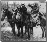 Men on horseback with gas masks